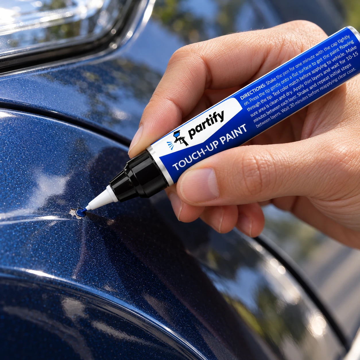 Placing a small dab of Partify pen paint inside a stone chip