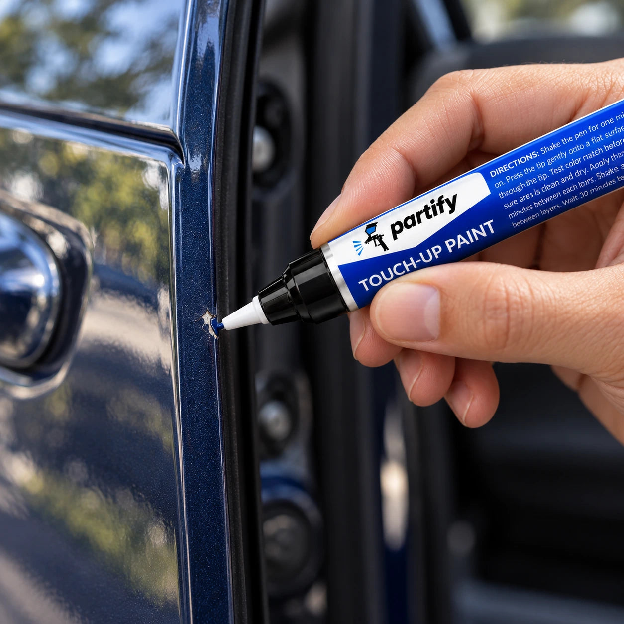 Placing a tiny dab of Partify pen paint inside a nick on a vehicle door edge