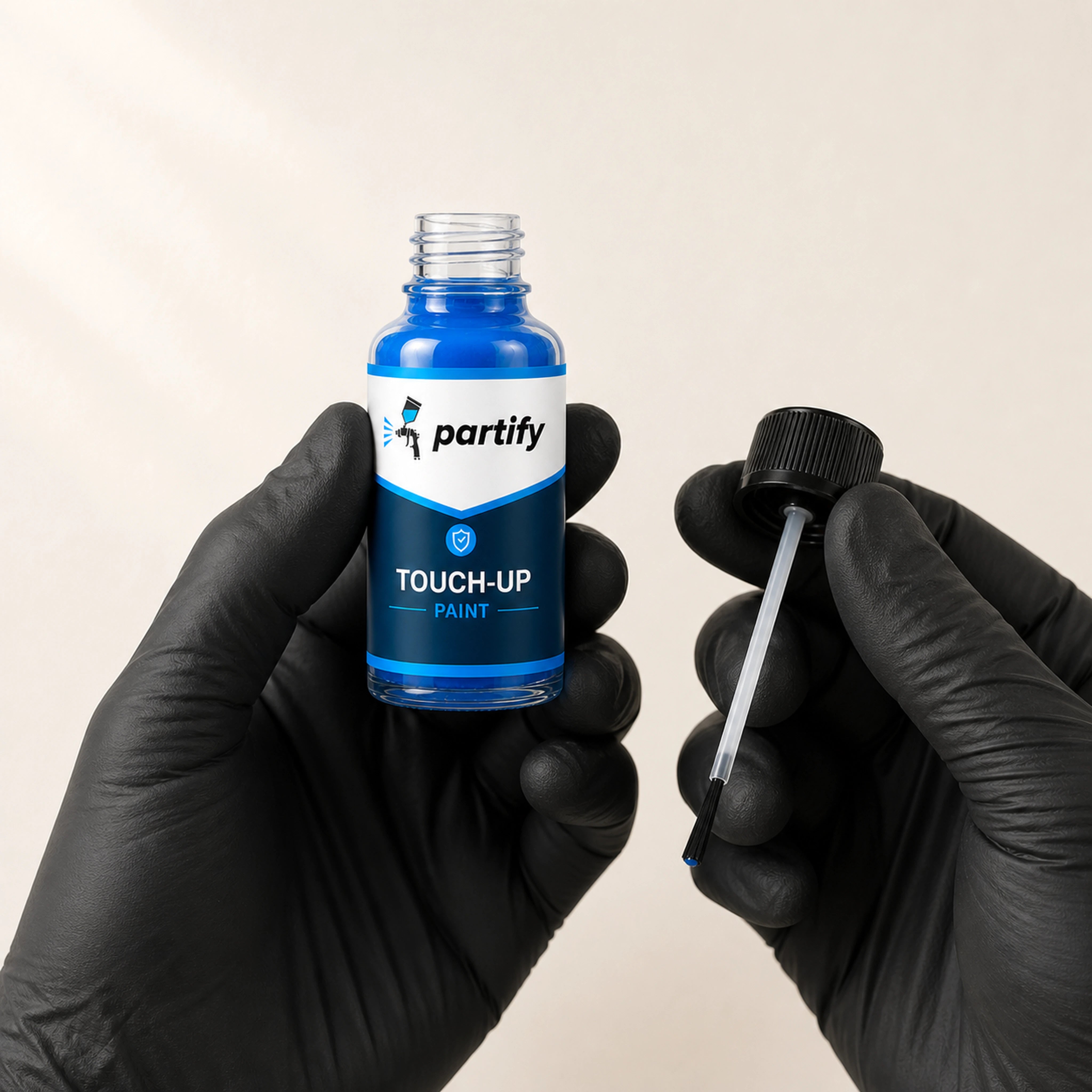 One-ounce Partify touch-up bottle and fine brush applicator shown in hand